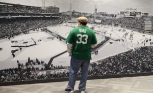 Man viewing the exhibit at the New England Sports Museum at TD Garden